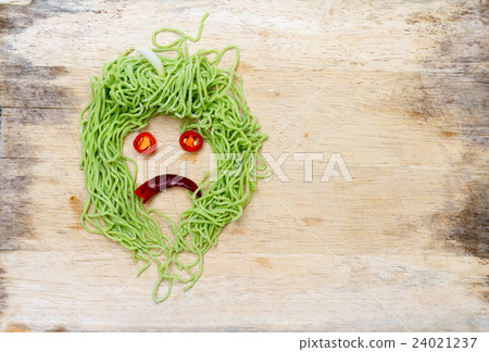 sad faces on wood background made from vegetable 24021237
