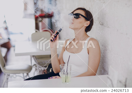 girl with the electronic cigarette girl with the electronic cigarette 24026713