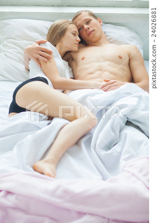 Lifestyle. Beautiful couple in bed Lifestyle. Beautiful couple in bed 24026881