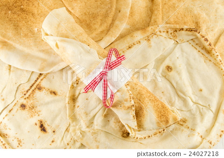 Fresh tortilla breads and empty wrapped one Fresh tortilla breads and empty wrapped one 24027218