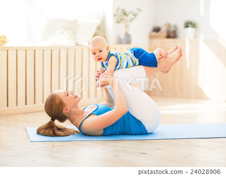 sports mother is engaged in fitness and yoga with baby at home sports mother is engaged in fitness and yoga with baby at home 24028906