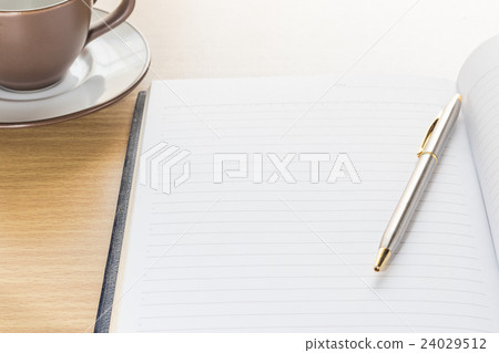 Pen and Notebook open blank page 24029512