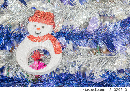 Snowman and tinsel holiday background Snowman and tinsel holiday background 24029540