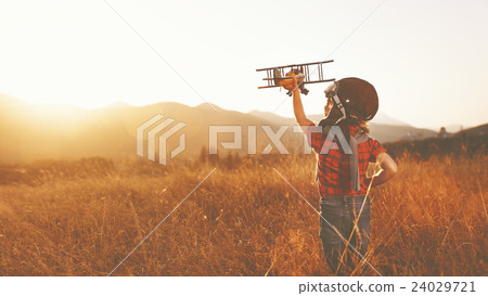 happy child dreams of traveling and playing with an airplane pil 24029721
