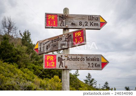 Hiking routes wooden road sigh in the mountains of 24034090