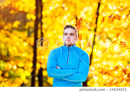 Young handsome hipster runner outside in sunny 24034855