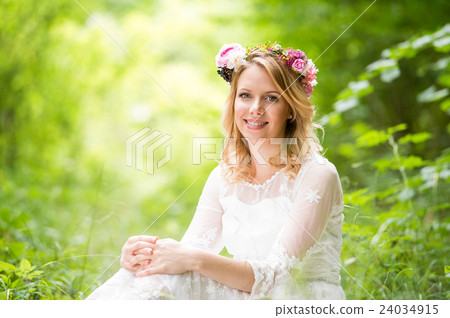 Bride in wedding dress with flower wreath, green Bride in wedding dress with flower wreath, green 24034915