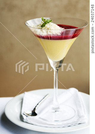 Desserts - Panna Cotta in cocktail glass on table Desserts - Panna Cotta in cocktail glass on table 24037148