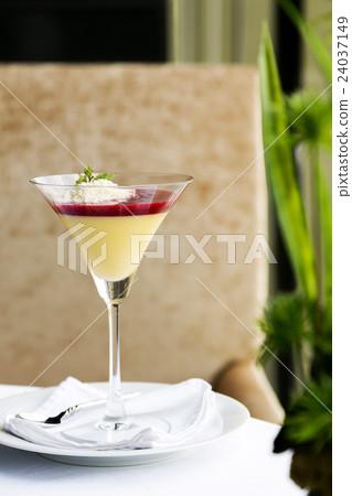 Desserts - Panna Cotta in cocktail glass on table 24037149