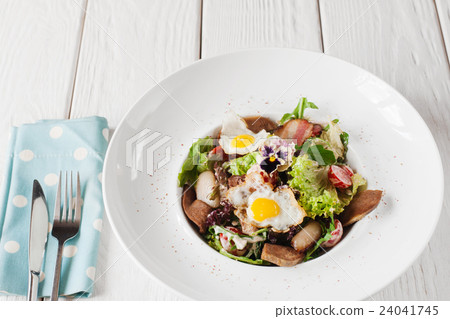 Salad with tongue on white wooden background Salad with tongue on white wooden background 24041745