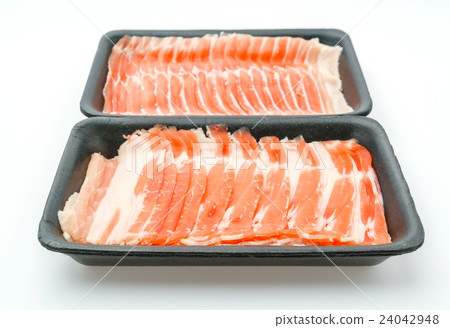 Slide of raw pork on white background . Slide of raw pork on white background . 24042948
