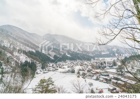 Winter Of Shirakawago with snow falling , Japan 24043175