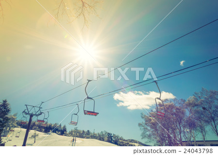 Sunset and Ski lift going over the mountain ( Filtered image processed vintage effect. ) Sunset and Ski lift going over the mountain ( Filtered image processed vintage effect. ) 24043798