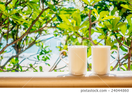 White coffee cup with outdoor view 24044860