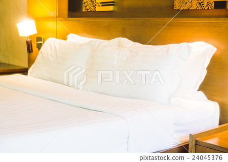 White pillow on bed White pillow on bed 24045376