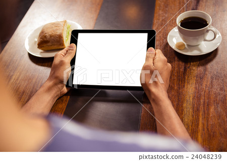 Man using a tablet Man using a tablet 24048239