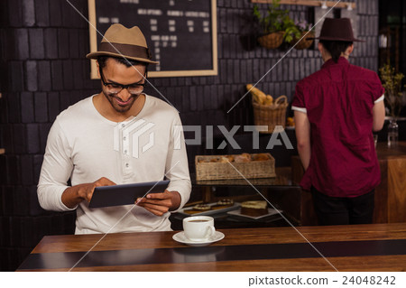 Man using a tablet Man using a tablet 24048242