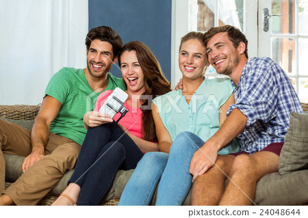 Group of friends taking a selfie Group of friends taking a selfie 24048644