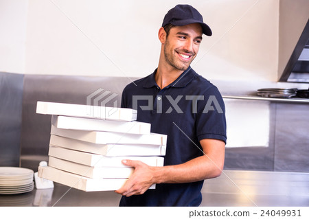 Pizza delivery man carrying boxes Pizza delivery man carrying boxes 24049931