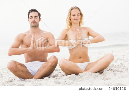 Happy couple doing yoga 24050128