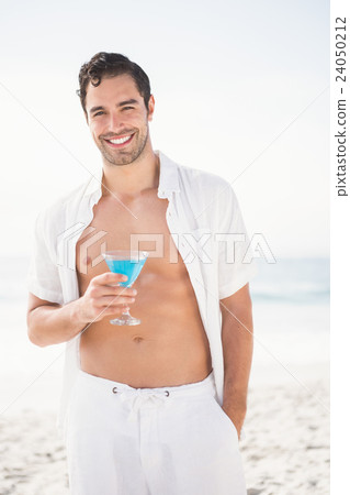 Man posing and drinking cocktail Man posing and drinking cocktail 24050212