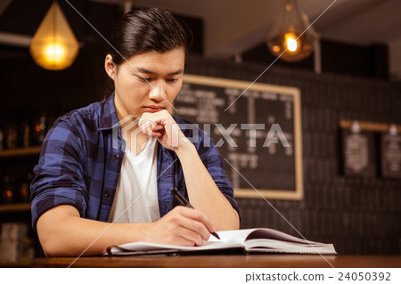 Hipster man using planner 24050392