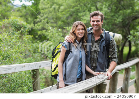 Portrait of happy couple on footbridge Portrait of happy couple on footbridge 24050907