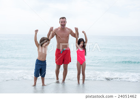 Happy father with children enjoying at beach Happy father with children enjoying at beach 24051462