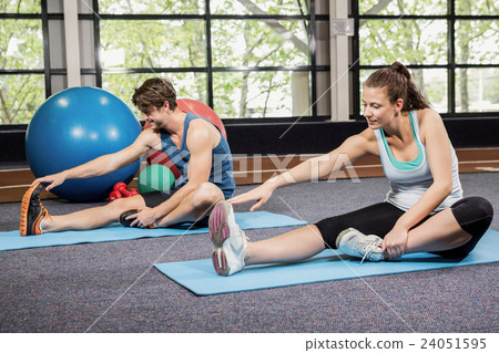 Man and woman performing fitness exercise Man and woman performing fitness exercise 24051595