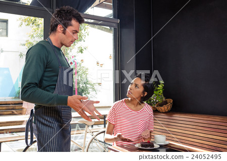 Disagreement between a waiter and a customer Disagreement between a waiter and a customer 24052495