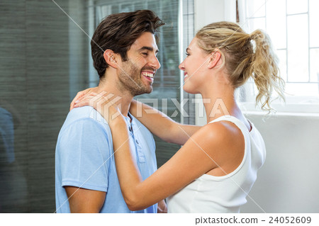 Young couple embracing in bathroom Young couple embracing in bathroom 24052609