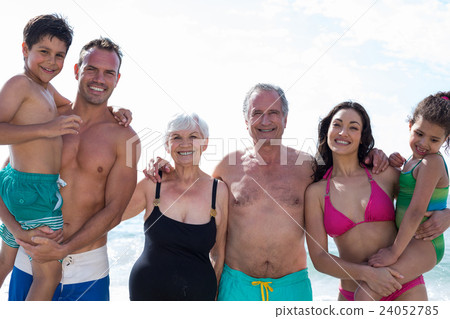 Portrait of smiling multi generation family at beach  24052785