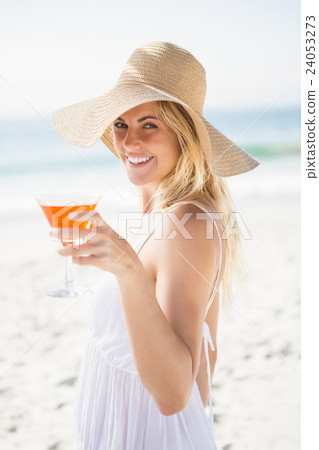 Blonde woman drinking cocktail 24053273