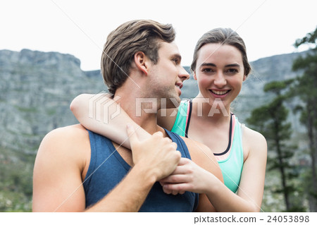 Happy couple embracing each other Happy couple embracing each other 24053898