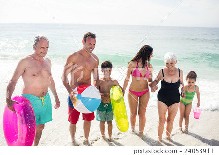 Happy family enjoying on beach Happy family enjoying on beach 24053911