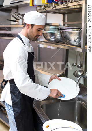 Handsome employee doing dishes 24054132