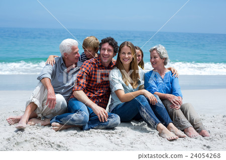 Multi-generation family smiling relaxing at sea shore 24054268