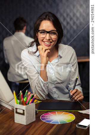 Creative businesswoman working on graphic tablet Creative businesswoman working on graphic tablet 24054981