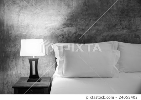 lamp and bed in the bedroom. 24055402