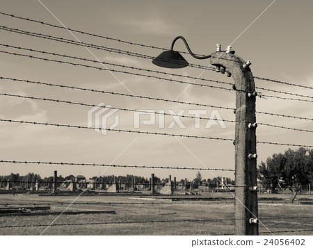 Barb wire fence with lamp in Oswiecim 24056402