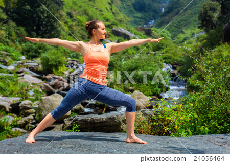 Woman doing Ashtanga Vinyasa Yoga Virabhadrasana 2 Woman doing Ashtanga Vinyasa Yoga Virabhadrasana 2 24056464