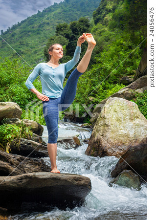 Woman doing Ashtanga Vinyasa Yoga asana outdoors 24056476