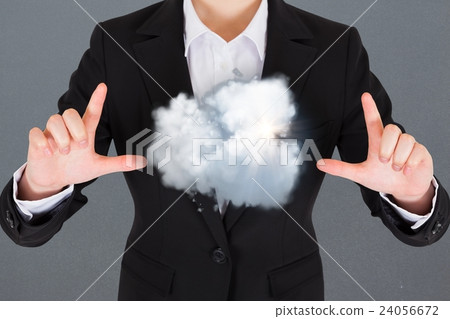 Composite image of a business man with a cloud Composite image of a business man with a cloud 24056672