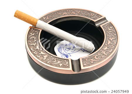 portrait of child and cigarette in metal ashtray 24057949