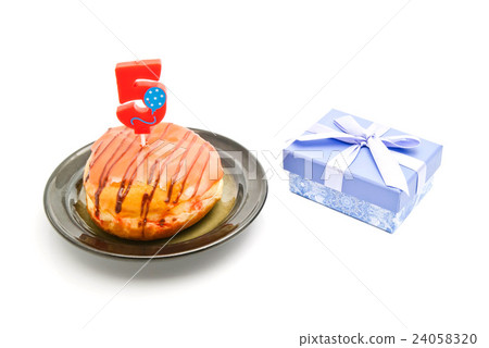 donut with five years birthday candle and gift donut with five years birthday candle and gift 24058320