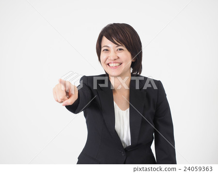 A business woman pointing at a smile 24059363