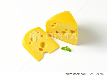 wedges of yellow cheese with eyes 24059782