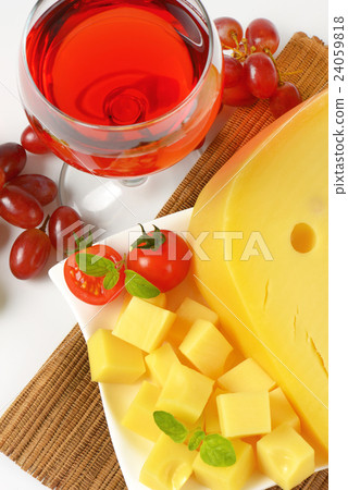 Swiss cheese, red wine and fresh grapes 24059818