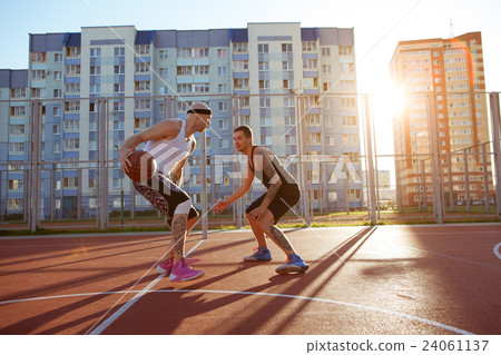 Two guys jump stretch to the ball on the Two guys jump stretch to the ball on the 24061137
