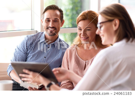 Positive colleagues using tablet Positive colleagues using tablet 24061183